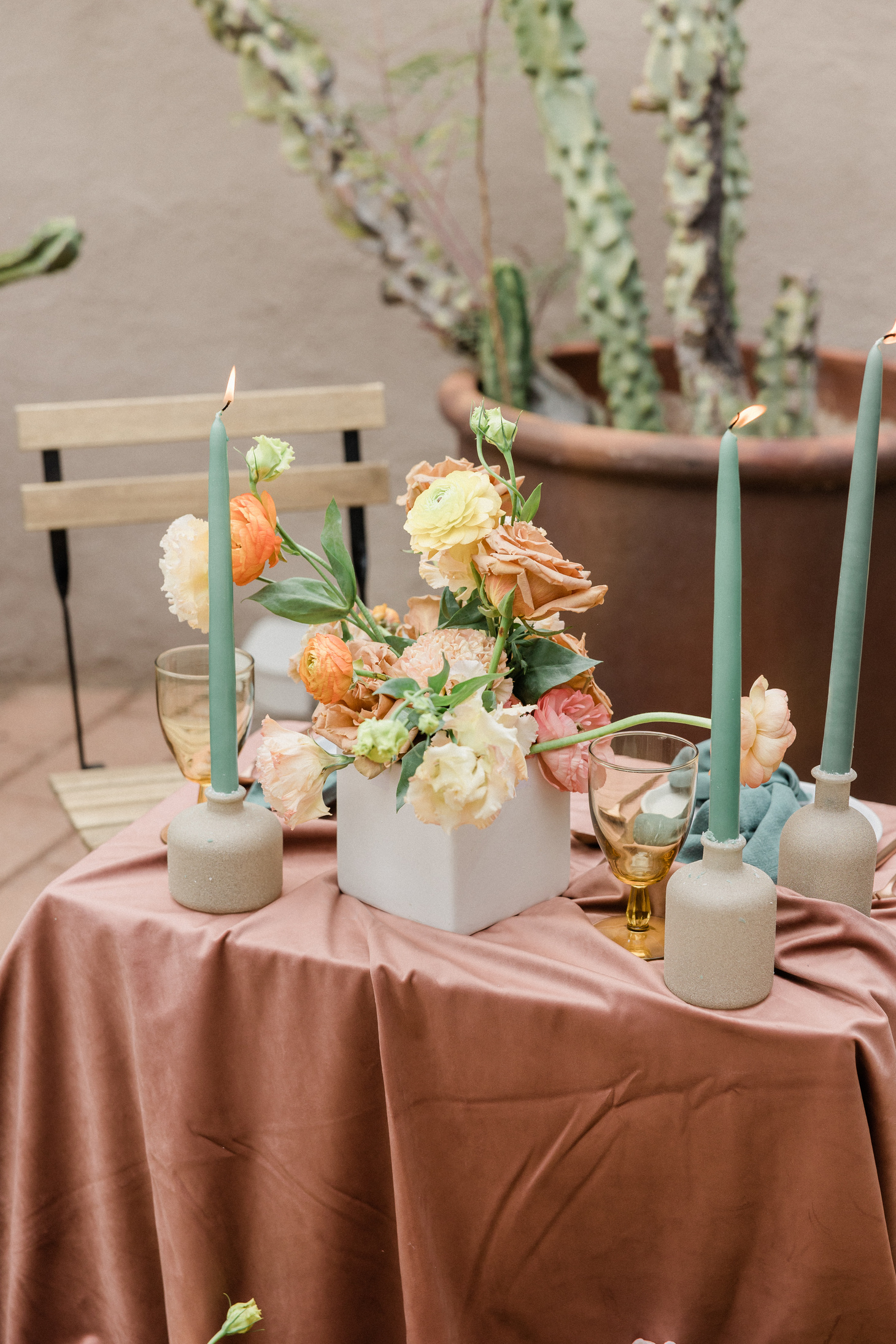 Neutral Flowers with Candle Light on Rustic Table Setting